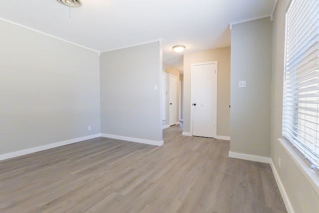 3319 Maxwell Dr, Midland, TX 79705 - empty room with light wood-style floors and crown molding