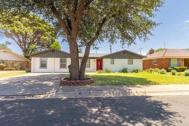 3319 Maxwell Dr, Midland, TX 79705 - single story home featuring a front yard, concrete driveway, and board and batten siding