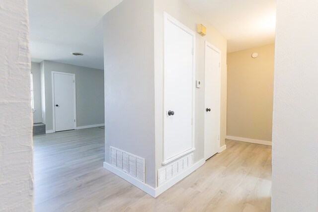 3319 Maxwell Dr, Midland, TX 79705 - corridor with light wood-type flooring and baseboards