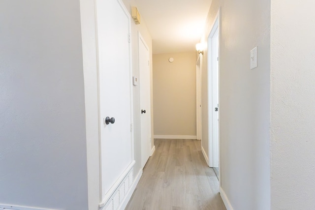 3319 Maxwell Dr, Midland, TX 79705 - hallway with light wood-style floors and baseboards