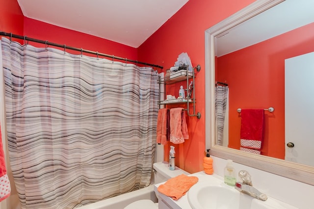 bathroom with shower / bath combo with shower curtain, vanity, and toilet