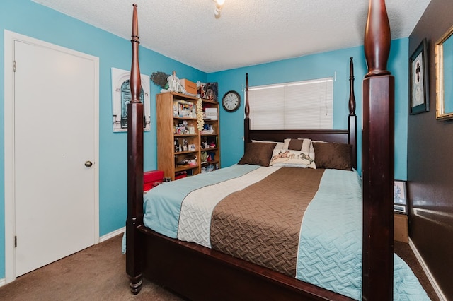 carpeted bedroom with a textured ceiling