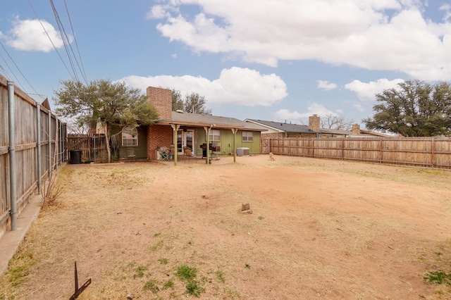 view of yard with a patio area and a fenced backyard