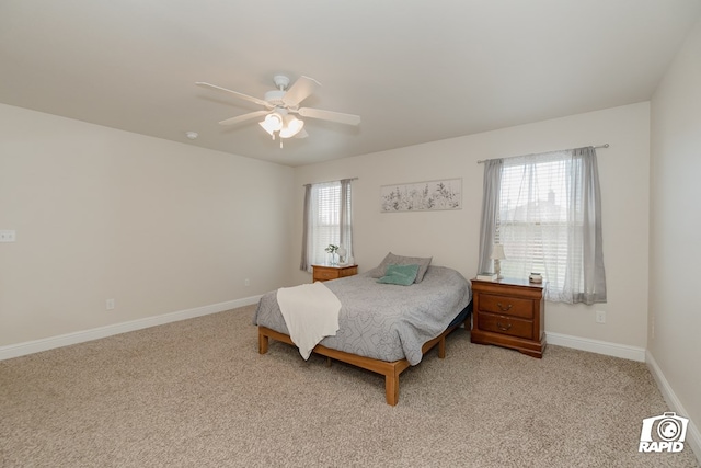 carpeted bedroom with multiple windows and ceiling fan