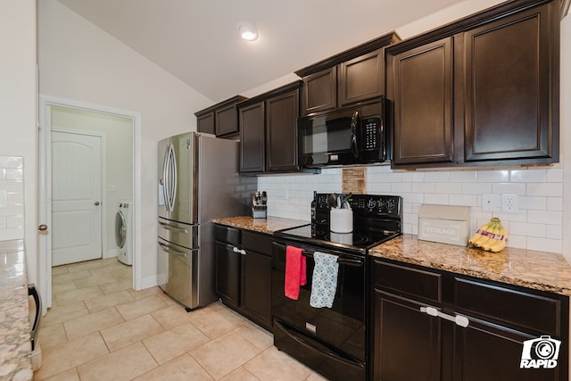 kitchen featuring decorative backsplash, light stone counters, black appliances, washer / clothes dryer, and lofted ceiling