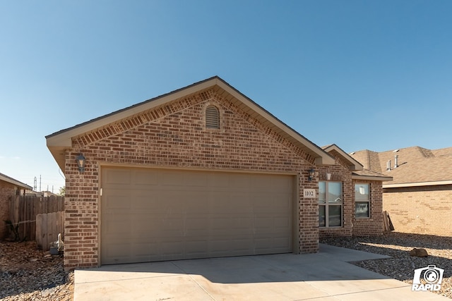 view of front of property with a garage