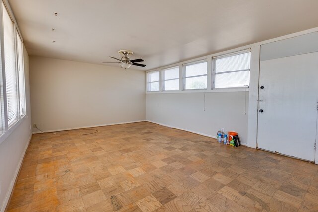 unfurnished room featuring ceiling fan and light parquet flooring