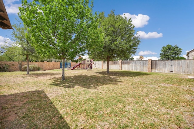 view of yard with a playground