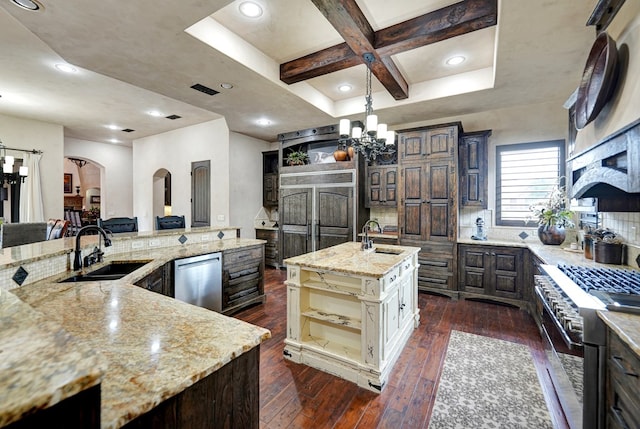 kitchen featuring a chandelier, a spacious island, a sink, high quality appliances, and coffered ceiling