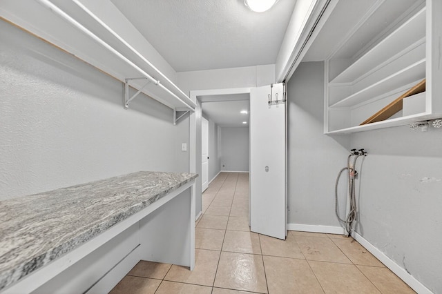 2502 W Cuthbert Ave, Midland, TX 79701 - spacious closet featuring light tile patterned floors