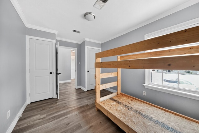2502 W Cuthbert Ave, Midland, TX 79701 - unfurnished bedroom with crown molding and wood finished floors