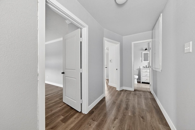 2502 W Cuthbert Ave, Midland, TX 79701 - corridor featuring wood finished floors and baseboards