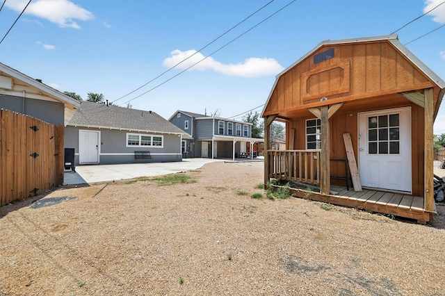 2502 W Cuthbert Ave, Midland, TX 79701 - back of house with an outdoor structure and a patio area
