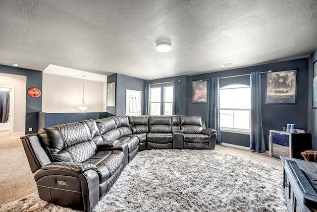 806 Revere Pl, Midland, TX 79706 - carpeted living room with baseboards, a textured ceiling, and visible vents