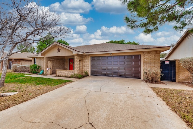 ranch-style home featuring a garage and a front yard