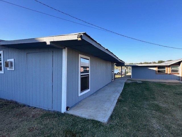 view of home's exterior with a yard