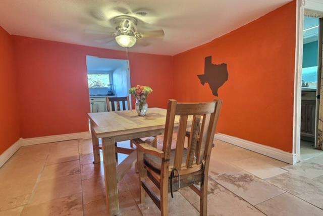 dining space featuring ceiling fan