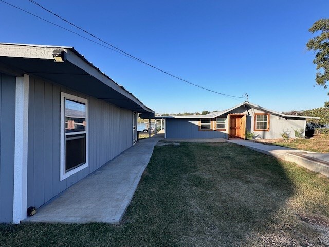 view of home's exterior with a lawn