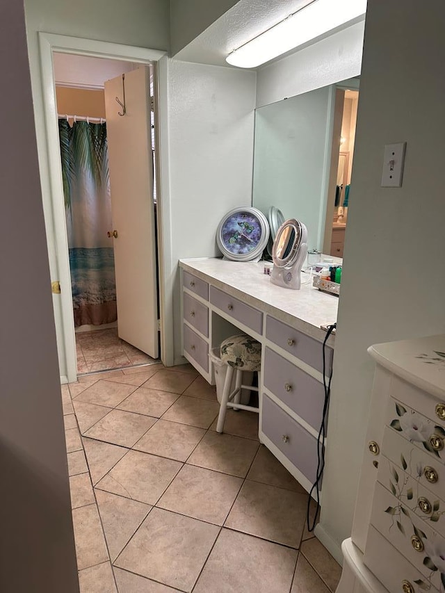 full bathroom featuring vanity and tile patterned floors