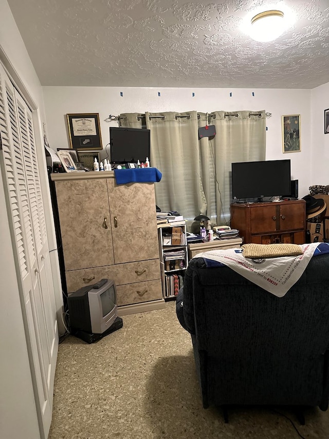 office area with a textured ceiling