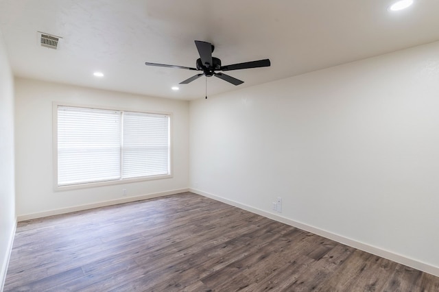 empty room featuring recessed lighting, visible vents, dark wood-type flooring, ceiling fan, and baseboards