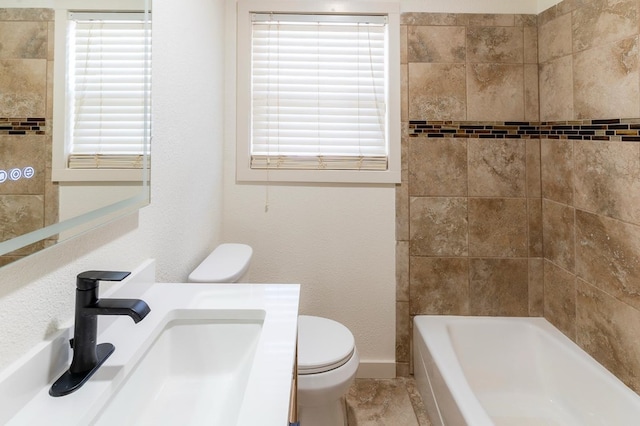 full bathroom featuring baseboards, vanity, and toilet