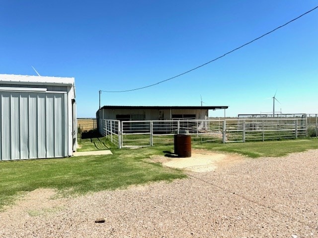 view of outbuilding featuring a rural view