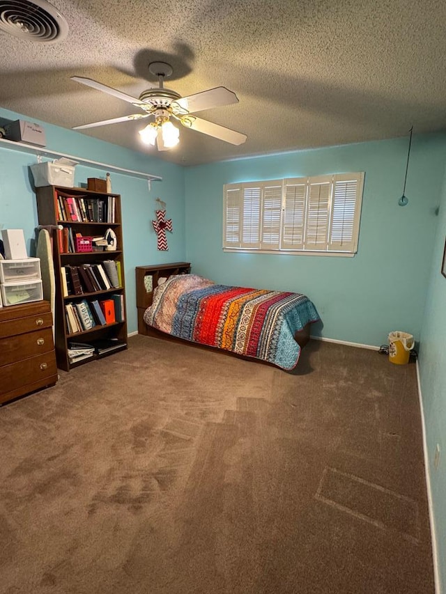 1512 W 14th St, Fort Stockton, TX 79735 - bedroom featuring carpet floors, a textured ceiling, a ceiling fan, and baseboards