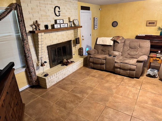 1512 W 14th St, Fort Stockton, TX 79735 - living room featuring a brick fireplace, tile patterned floors, and baseboards