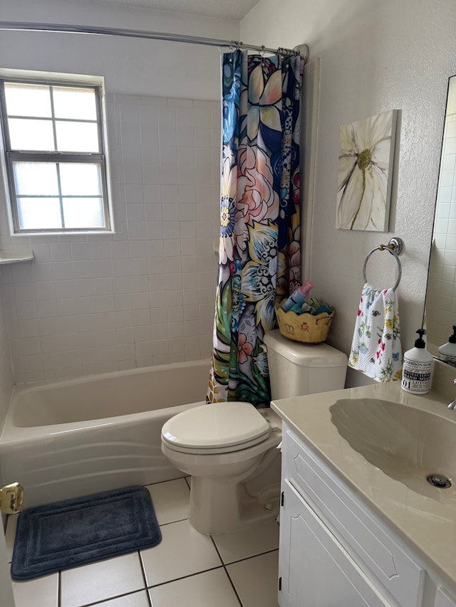 1512 W 14th St, Fort Stockton, TX 79735 - full bath with tile patterned floors, vanity, toilet, shower / bath combo with shower curtain, and a textured wall