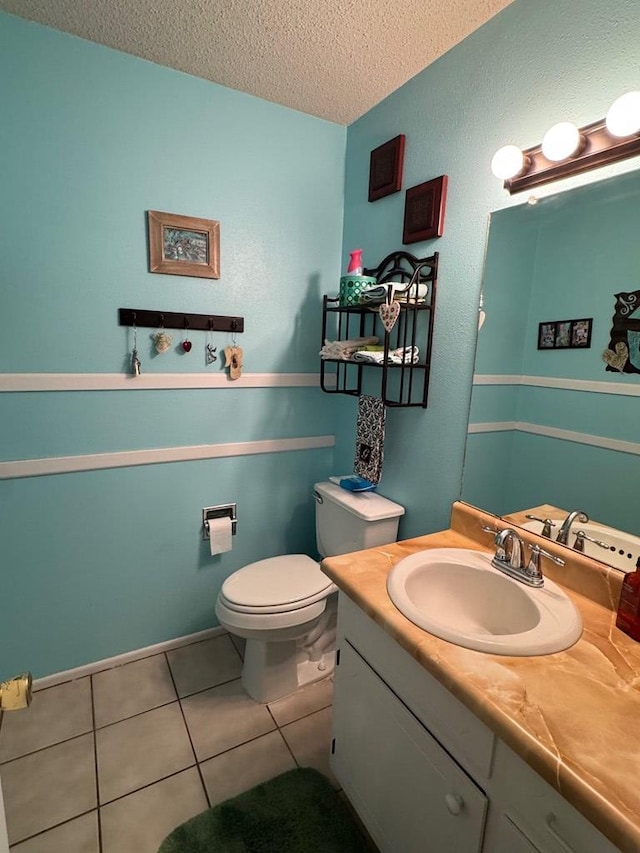 1512 W 14th St, Fort Stockton, TX 79735 - half bathroom with a textured ceiling, vanity, toilet, and tile patterned flooring