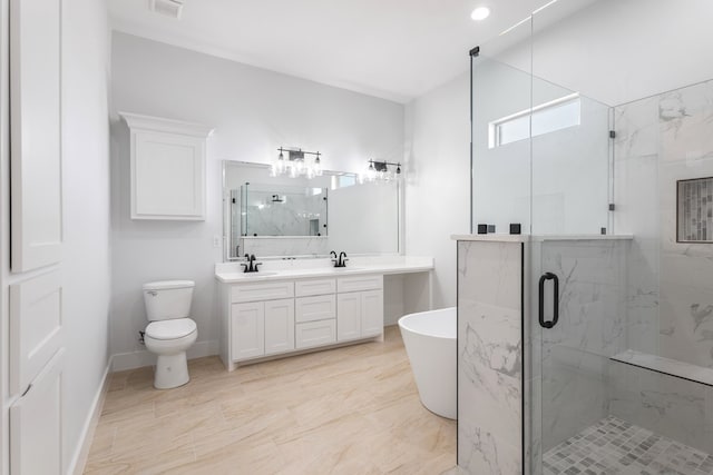 full bathroom featuring independent shower and bath, vanity, and toilet