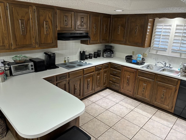 kitchen featuring dishwasher, light tile patterned floors, sink, and electric stovetop