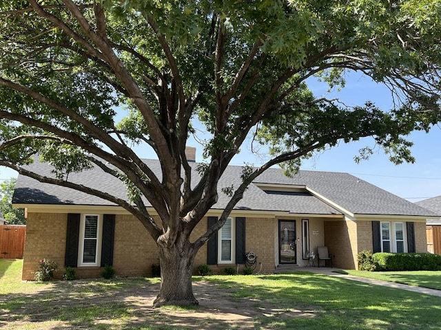 4704 Elma Dr, Midland, TX 79707 - single story home with brick siding and a shingled roof