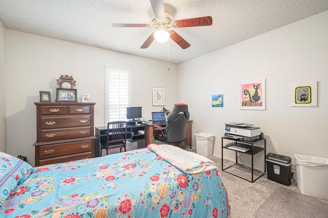 4704 Elma Dr, Midland, TX 79707 - bedroom with carpet, a textured ceiling, and a ceiling fan