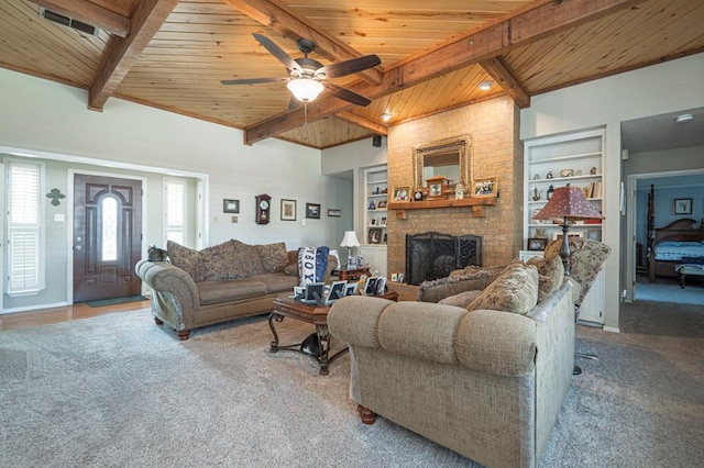 4704 Elma Dr, Midland, TX 79707 - living area with wood ceiling with exposed beams, healthy amount of natural light, a brick fireplace, a ceiling fan, and built in features