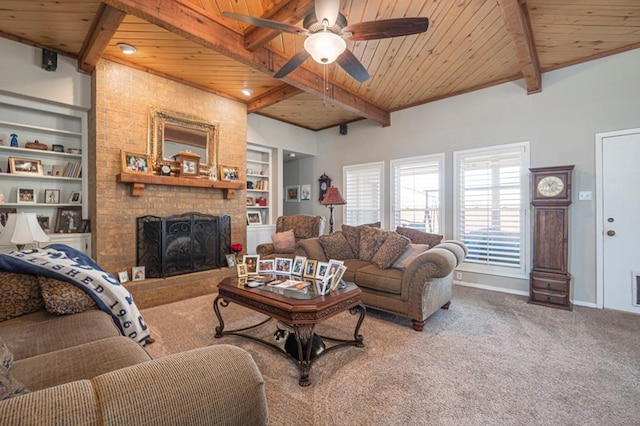 4704 Elma Dr, Midland, TX 79707 - living room with wooden ceiling with exposed beams, a fireplace, carpet, built in features, and a ceiling fan