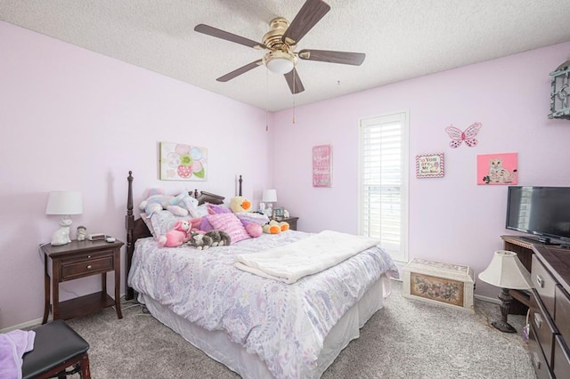 4704 Elma Dr, Midland, TX 79707 - carpeted bedroom with a textured ceiling and a ceiling fan