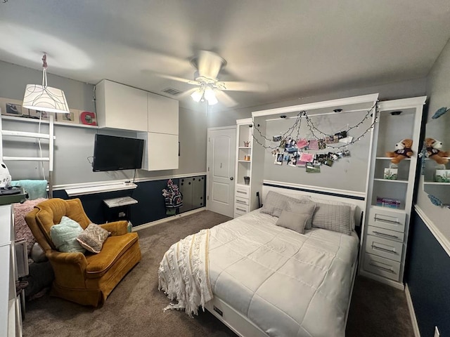 bedroom featuring dark colored carpet and ceiling fan