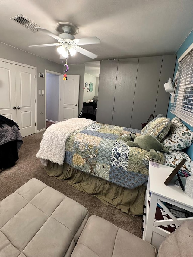 carpeted bedroom featuring ceiling fan