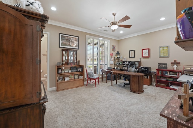 carpeted office space featuring ceiling fan and ornamental molding