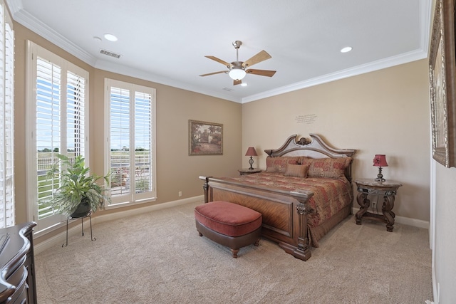 bedroom with light carpet, ceiling fan, and crown molding