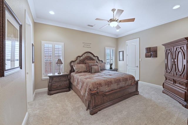 carpeted bedroom with ceiling fan and crown molding