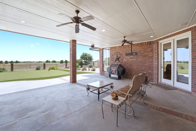 view of patio with ceiling fan and grilling area