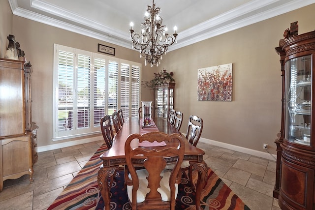 dining room featuring an inviting chandelier and crown molding