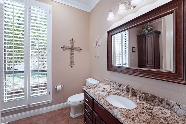 bathroom with tile patterned floors, vanity, toilet, and crown molding