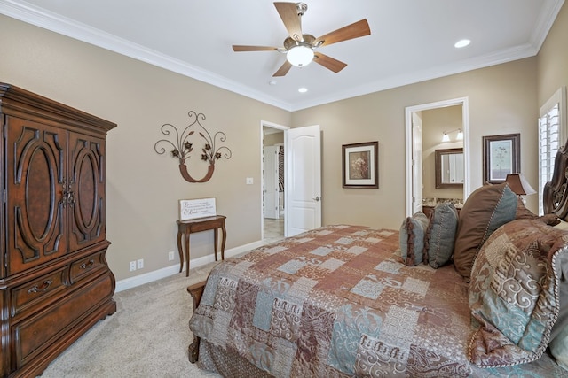 carpeted bedroom featuring ensuite bathroom, ceiling fan, and crown molding