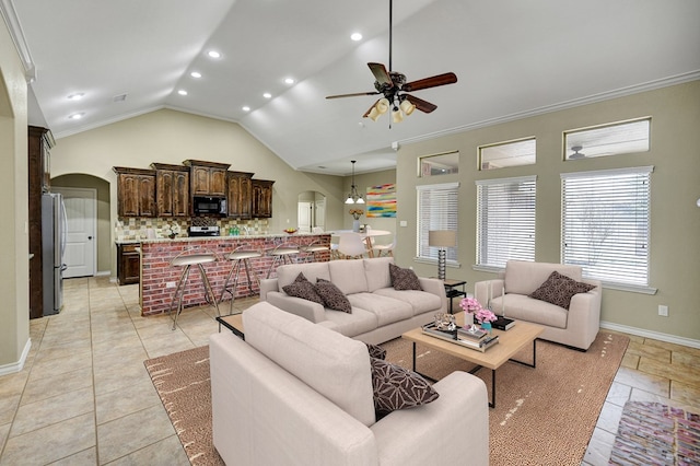 living area with a ceiling fan, baseboards, recessed lighting, arched walkways, and crown molding