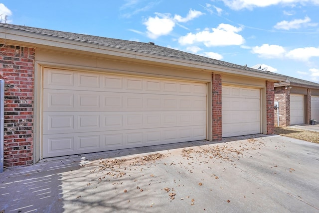 garage featuring driveway