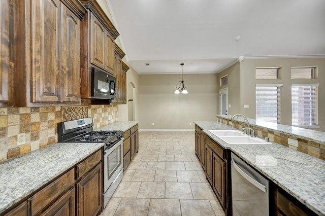 kitchen with a sink, backsplash, appliances with stainless steel finishes, crown molding, and baseboards